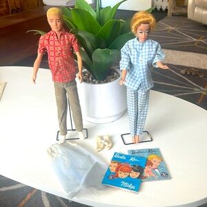 Vintage 1960’s Ken and Barbie with clothes, accessories and stands